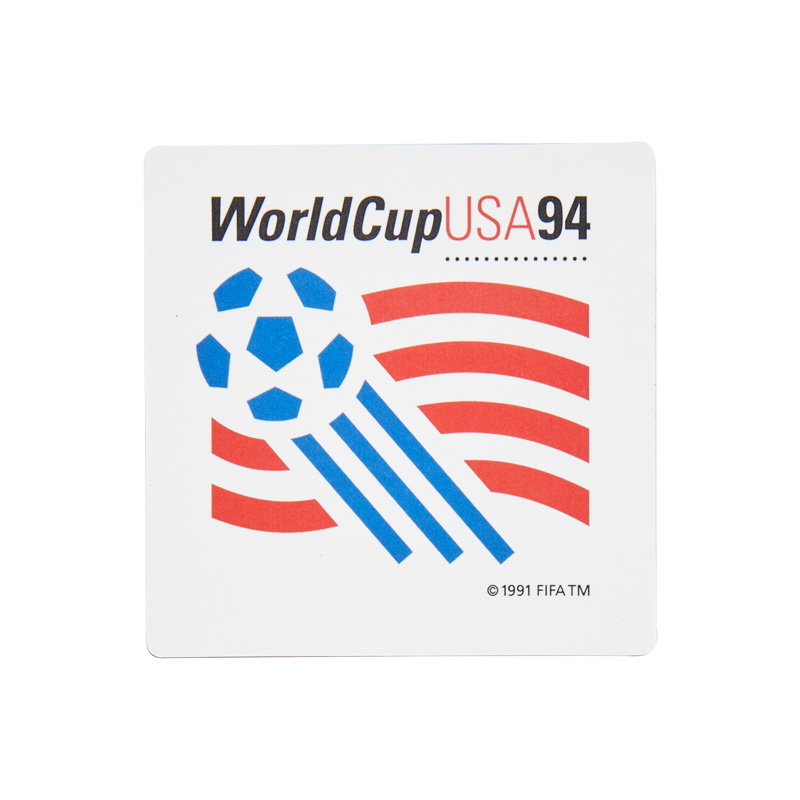 White Magnet with a blue ball, and red, and black elements, representing the celebration of the World Cup in the USA back in 1994.