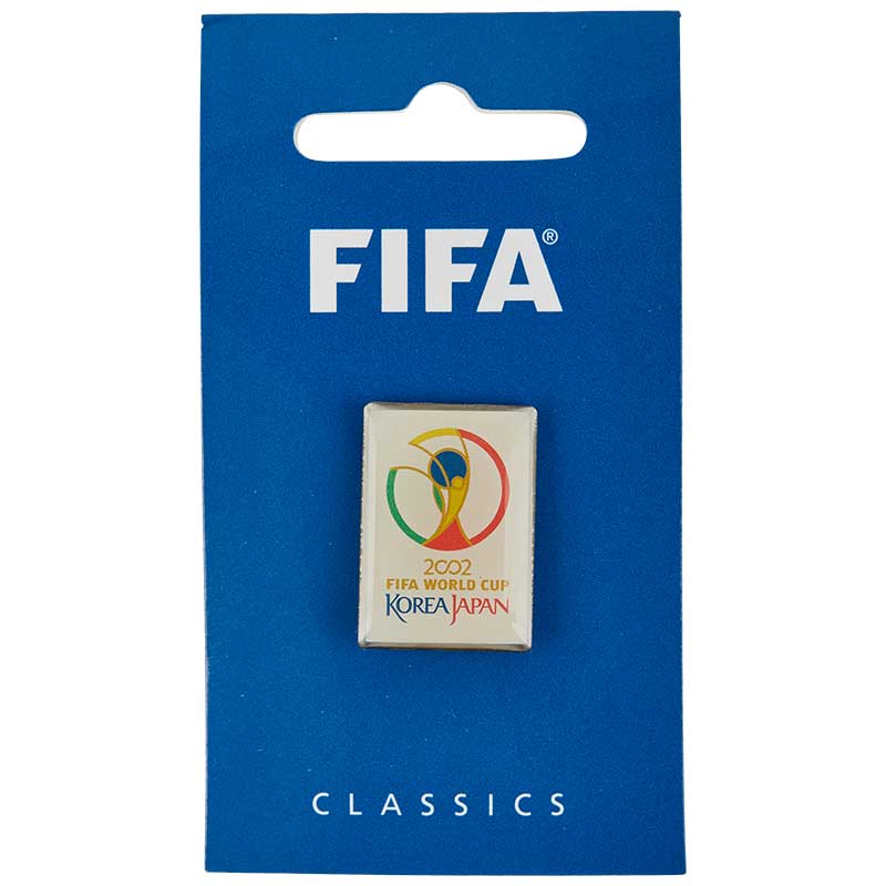 A rectangular white pin showing the 2002 South Korea Japan FIFA World Cup Championship with the turnament logo displayed.
