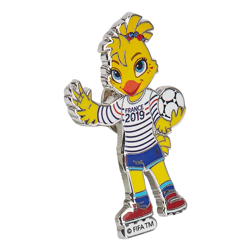 A metal pin of the iconic FIFA World Cup Mascot Ettie, wearing a T-shirt of the France World Championship of 2019, holding a football.