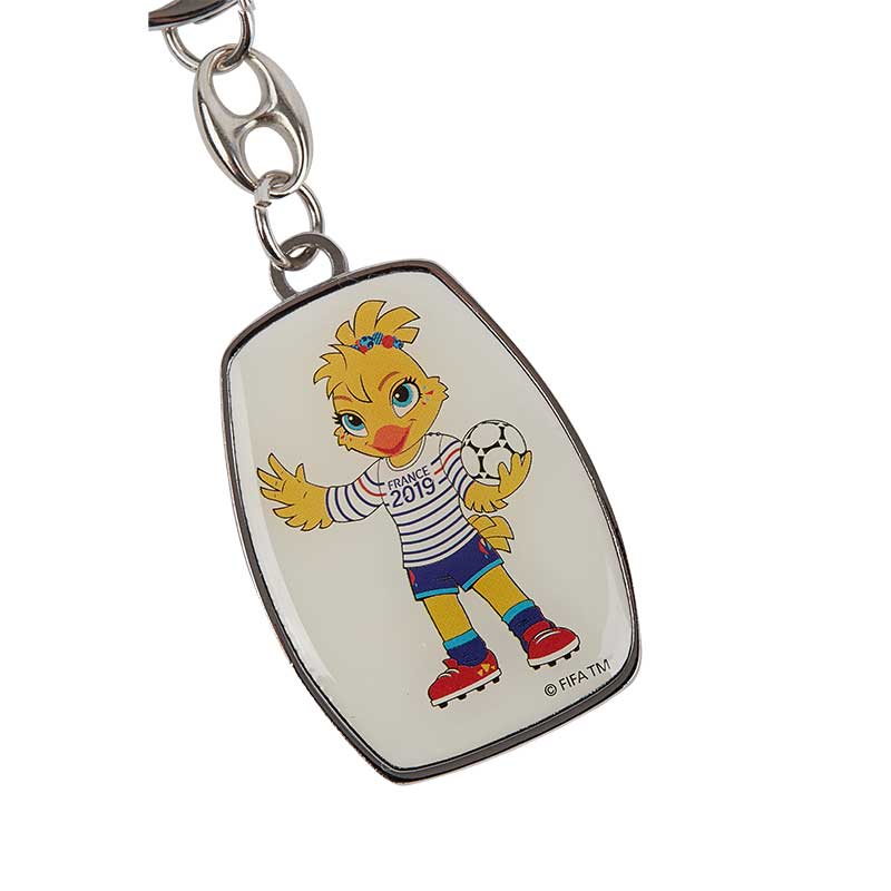 A metal keyring in white depicting the FIFA World Cup Mascot Ettie in a striped T-shirt from the FWC in France 2019 and holding a football.
