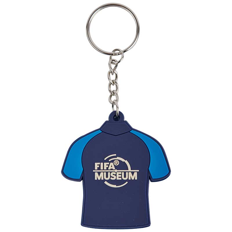 The backside of a Keyring in the form of a football jersey in dark and light blue colors featuring the official FIFA Museum trademark.