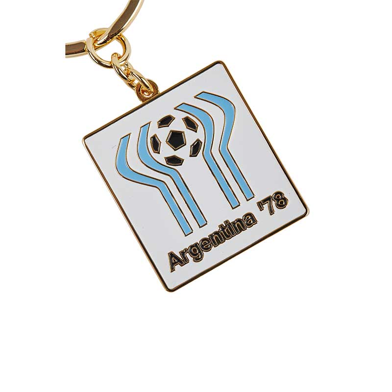 White Square keyring with black & blue elements and an illustration of a football at the top, representing the FWC in Argentina in 1978.