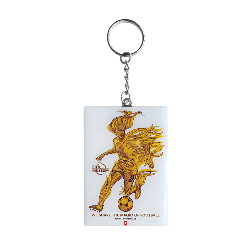 A white keyring with the words 'Share the magic of football' at the bottom with the 2023 'Trailblazer' and Switzerland logo.